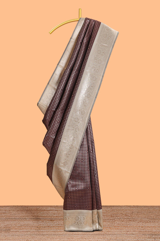 Dark brown checked floral motifs design semi soft silk saree with contrast border and blouse