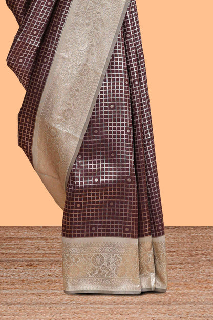 Dark brown checked floral motifs design semi soft silk saree with contrast border and blouse