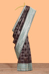 Dark brown checked floral motifs design semi soft silk saree with contrast border and blouse