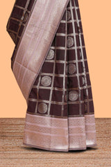 Dark brown checked floral motifs design semi soft silk saree with contrast border and blouse