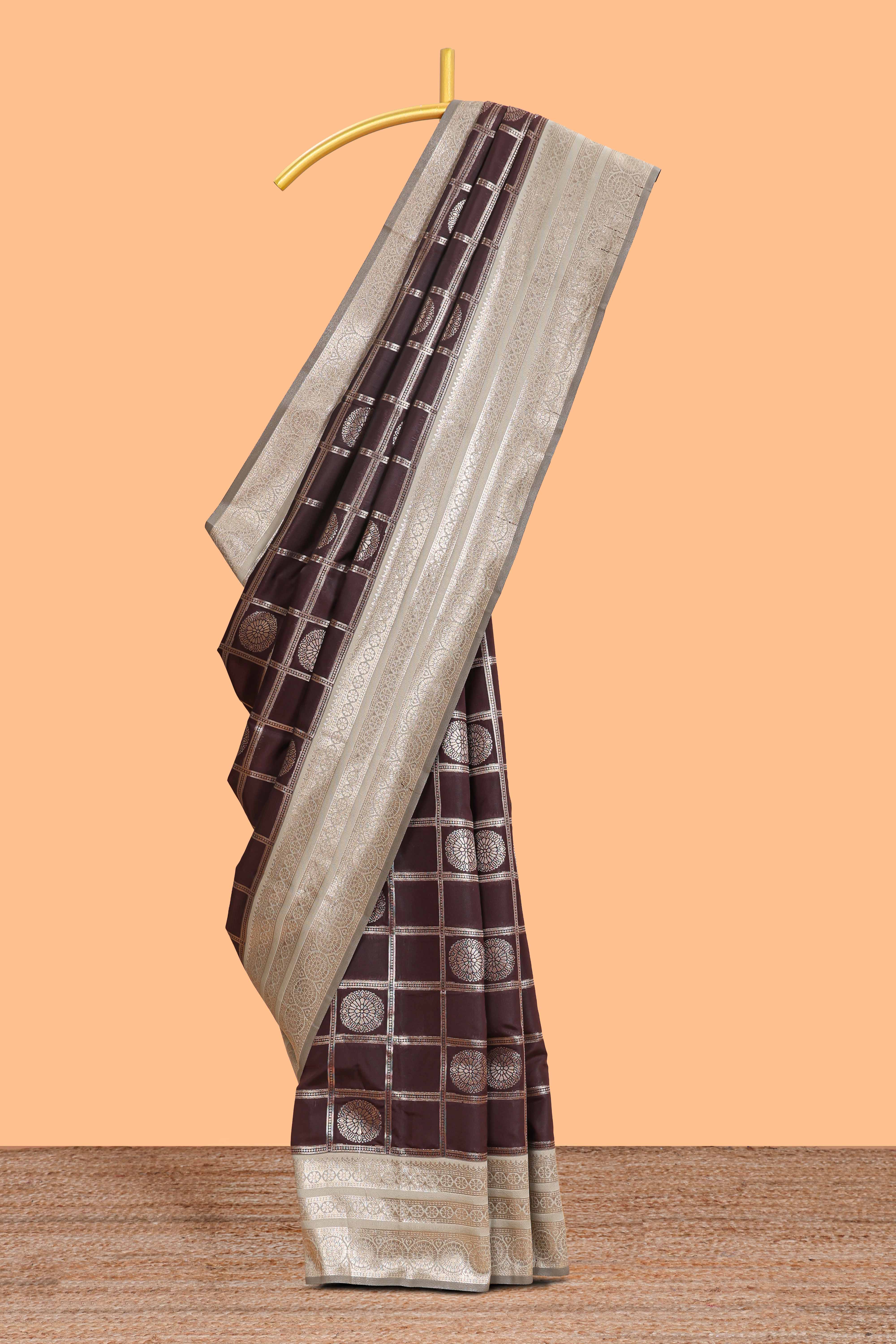 Dark brown checked floral motifs design semi soft silk saree with contrast border and blouse