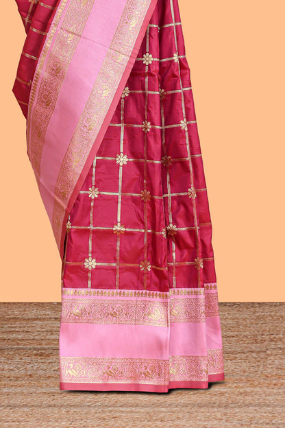 Maroon checked floral zari design semi soft silk saree with contrast bentex border and floral motifs blouse