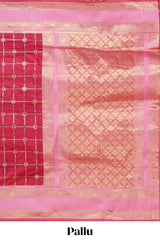 Maroon checked floral zari design semi soft silk saree with contrast bentex border and floral motifs blouse