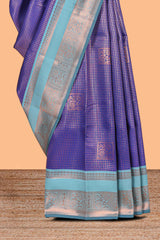 Blue checked floral motifs design semi soft silk saree with contrast zari border and floral motifs blouse