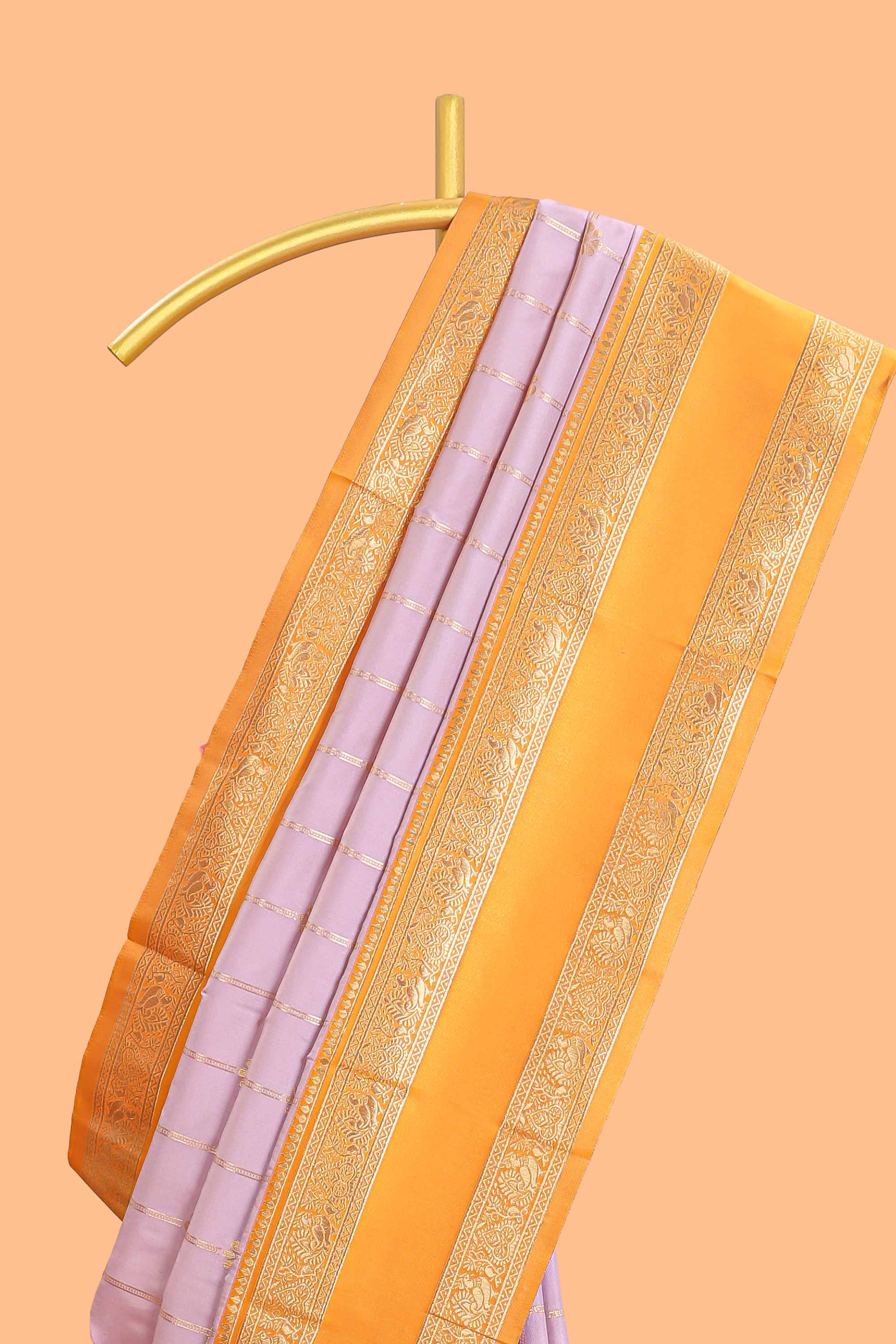 Pale lavender checked floral zari design semi soft silk saree with contrast bentex border and floral motifs blouse