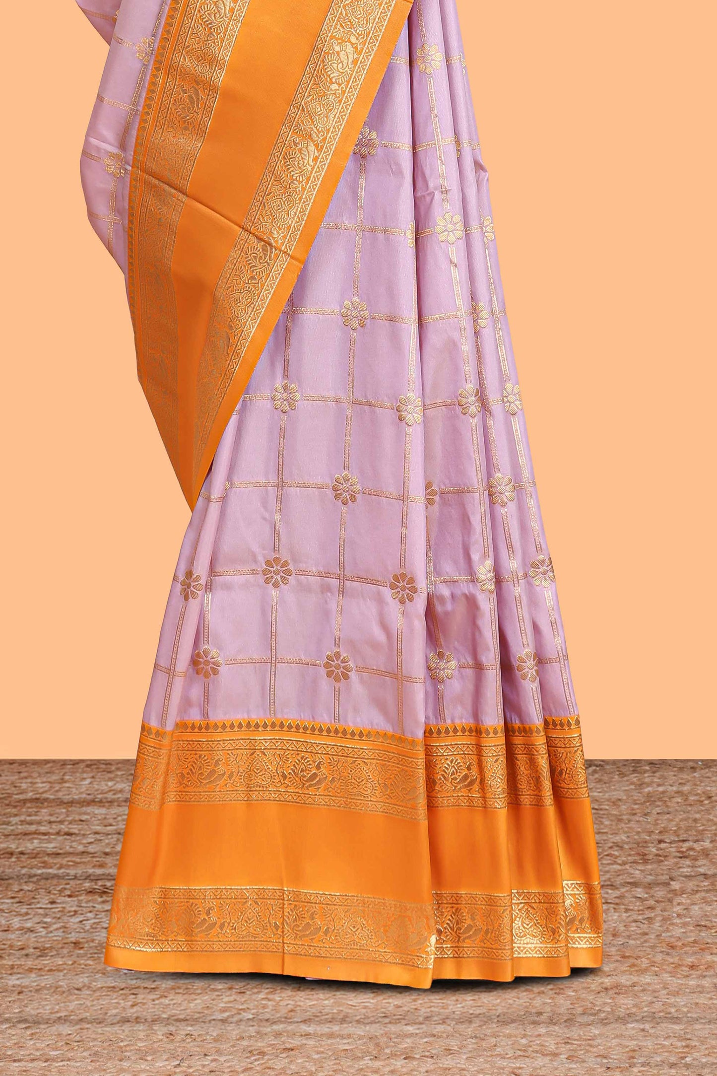 Pale lavender checked floral zari design semi soft silk saree with contrast bentex border and floral motifs blouse
