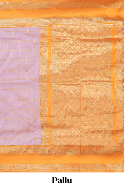 Pale lavender checked floral zari design semi soft silk saree with contrast bentex border and floral motifs blouse