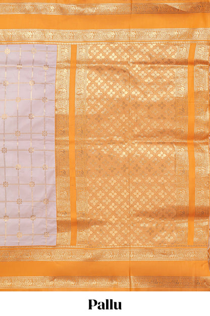 Cream checked floral zari design semi soft silk saree with contrast bentex border and floral motifs blouse
