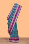 Green checked floral zari design semi soft silk saree with contrast bentex border and floral motifs blouse