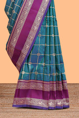 Green checked floral zari design semi soft silk saree with contrast bentex border and floral motifs blouse