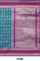 Green checked floral zari design semi soft silk saree with contrast bentex border and floral motifs blouse