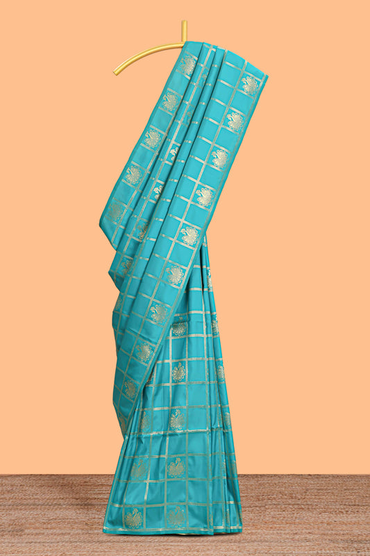 Borderless green checked floral motifs zari design semi soft silk saree with matching zari motifs blouse