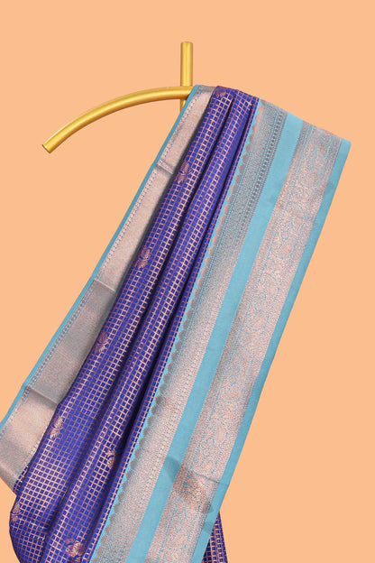Blue checked floral motifs design semi soft silk saree with contrast zari border and floral motifs blouse