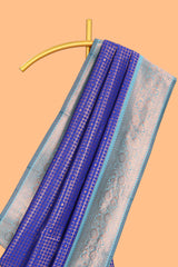 Blue checked & dotted motifs semi soft silk saree with contrast zari border and floral motifs blouse