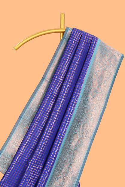Blue checked & dotted motifs semi soft silk saree with contrast zari border and floral motifs blouse