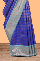 Blue checked & dotted motifs semi soft silk saree with contrast zari border and floral motifs blouse