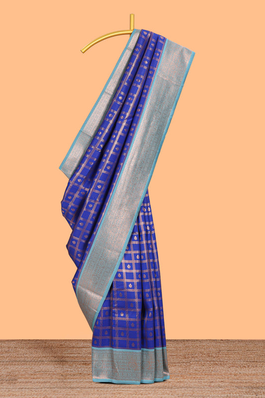 Blue checked floral design motifs semi soft silk saree with contrast zari border and floral motifs blouse