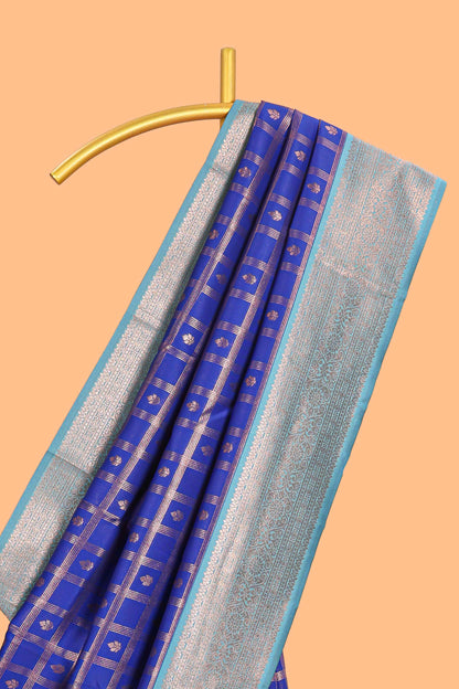Blue checked floral design motifs semi soft silk saree with contrast zari border and floral motifs blouse