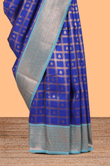 Blue checked floral design motifs semi soft silk saree with contrast zari border and floral motifs blouse