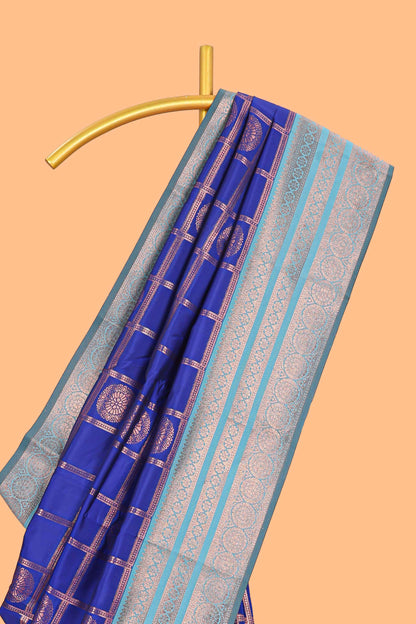 Blue checked floral design motifs semi soft silk saree with contrast zari border and floral motifs blouse