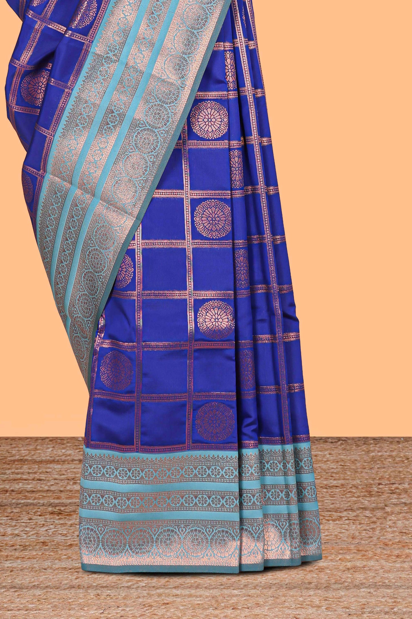Blue checked floral design motifs semi soft silk saree with contrast zari border and floral motifs blouse