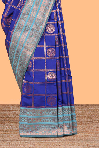 Blue checked floral design motifs semi soft silk saree with contrast zari border and floral motifs blouse