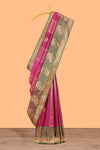 Magenta colour semi soft silk saree with contrast paisely border and contrast zari buttas blouse