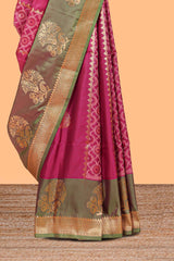 Magenta colour semi soft silk saree with contrast paisely border and contrast zari buttas blouse