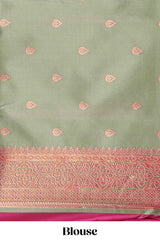 Magenta colour semi soft silk saree with contrast paisely border and contrast zari buttas blouse