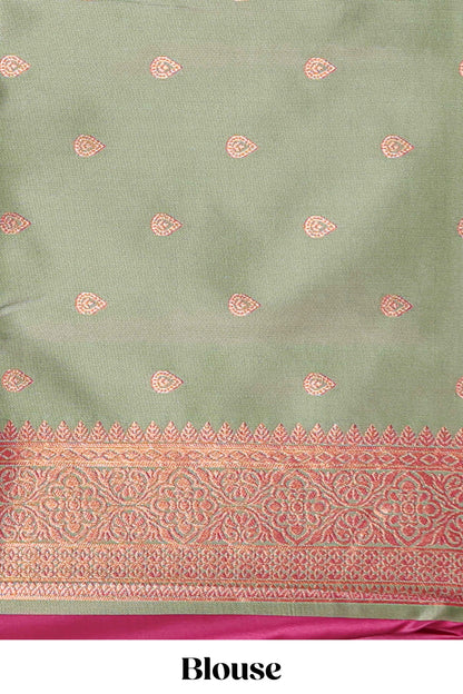 Magenta colour semi soft silk saree with contrast paisely border and contrast zari buttas blouse