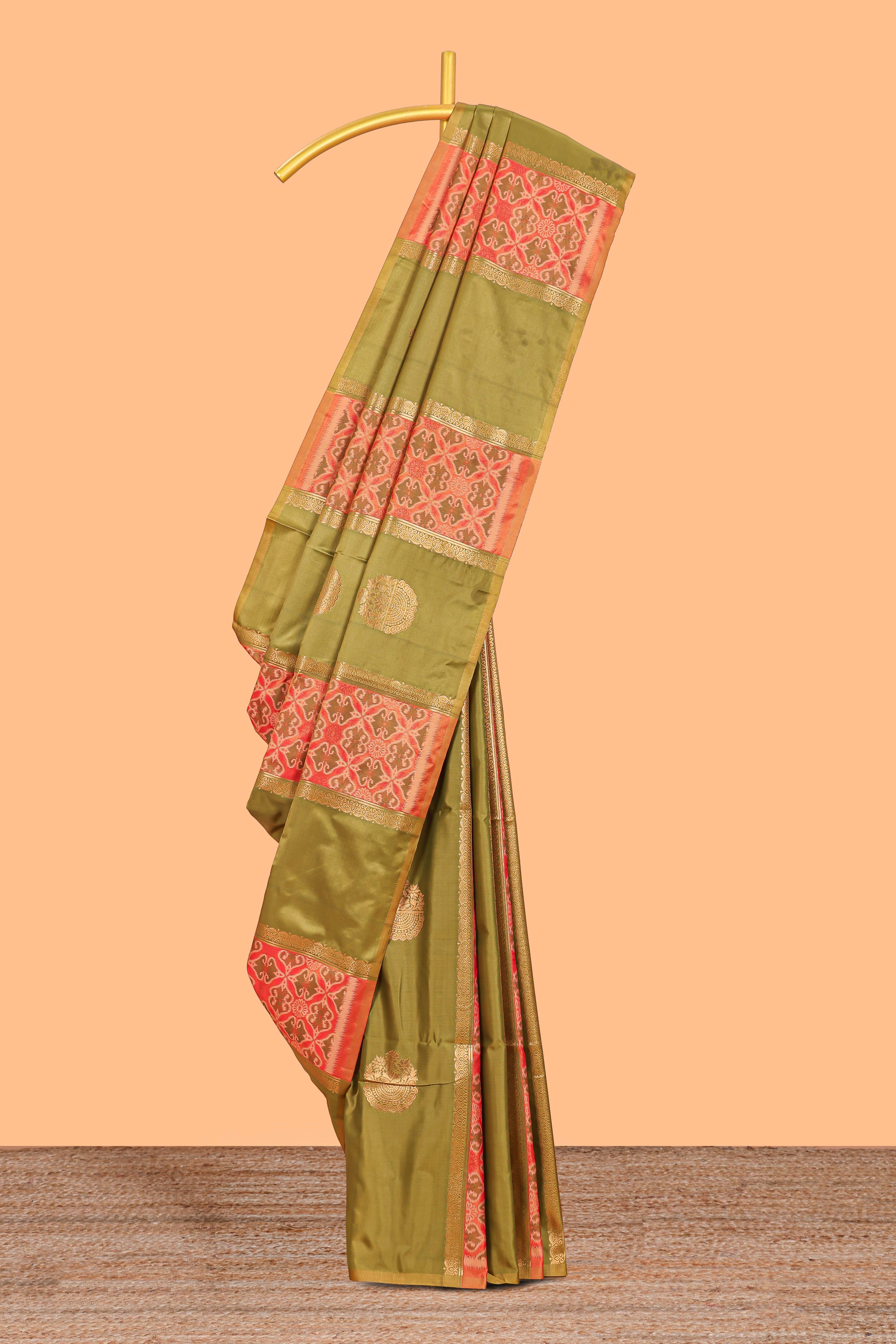 Green semi soft silk saree patola printed body with zari border and rich contrast pallu with contrast blouse