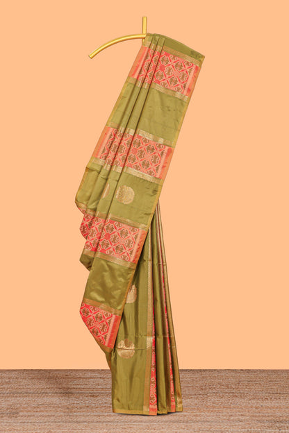 Green semi soft silk saree patola printed body with zari border and rich contrast pallu with contrast blouse