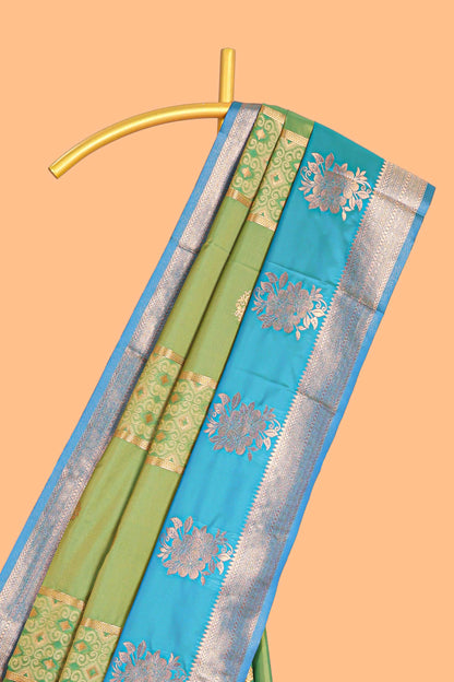 Green Semi soft silk saree  copper  zari motifs with contrast border and pallu with a matching  blouse