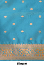 Green Semi soft silk saree  copper  zari motifs with contrast border and pallu with a matching  blouse
