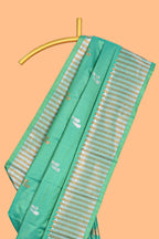Green colour semi soft silk Woven Zari-Inspired Motifs and Geometric Weave Design border with contrast pallu and blouse