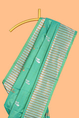Green colour semi soft silk Woven Zari-Inspired Motifs and Geometric Weave Design border with contrast pallu and blouse