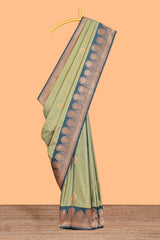 Green colour semi soft silk all over zari striped pattern with contrast zari weaving border and contrast buttas weaving blouse