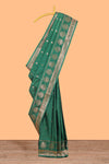 Bottle Green colour semi soft silk all over zari weave motifs with zari weaving border and contrast buttas weaving blouse