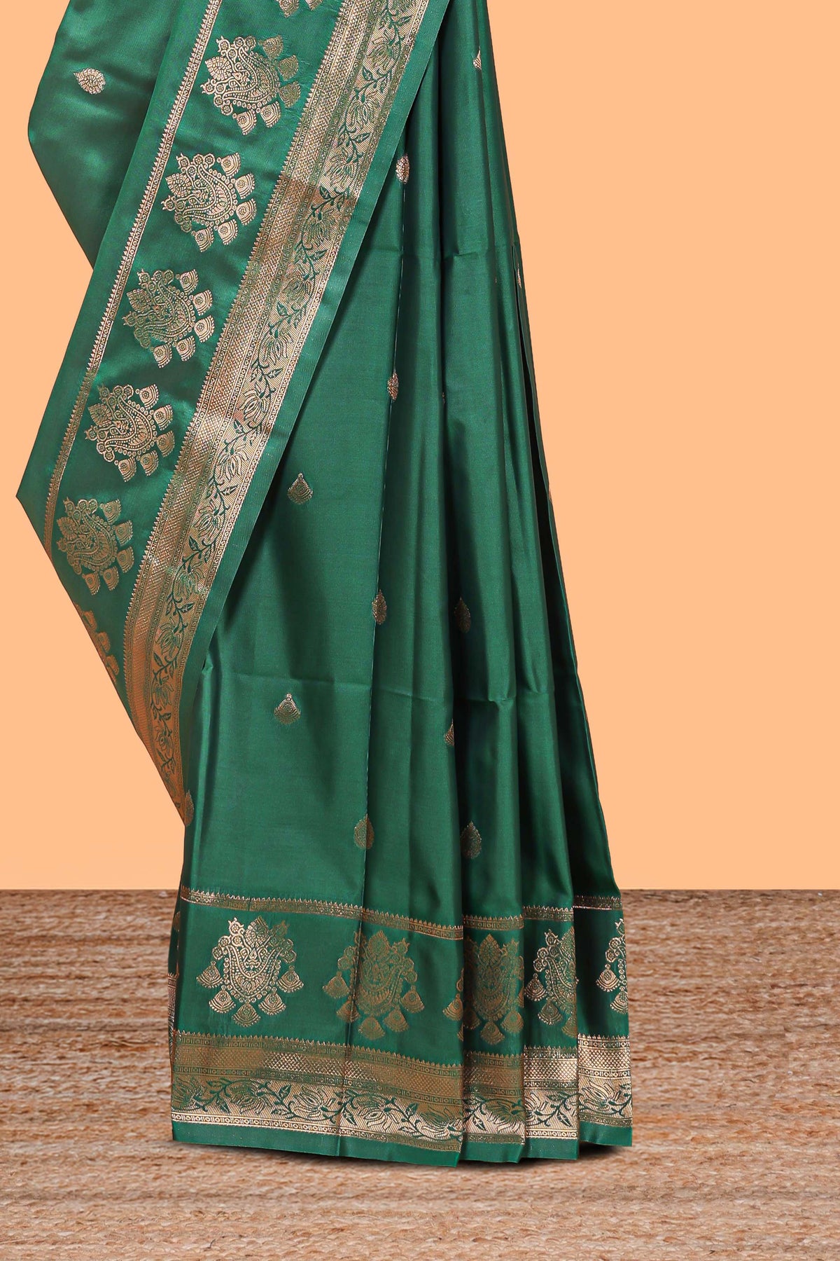 Bottle Green colour semi soft silk all over zari weave motifs with zari weaving border and contrast buttas weaving blouse