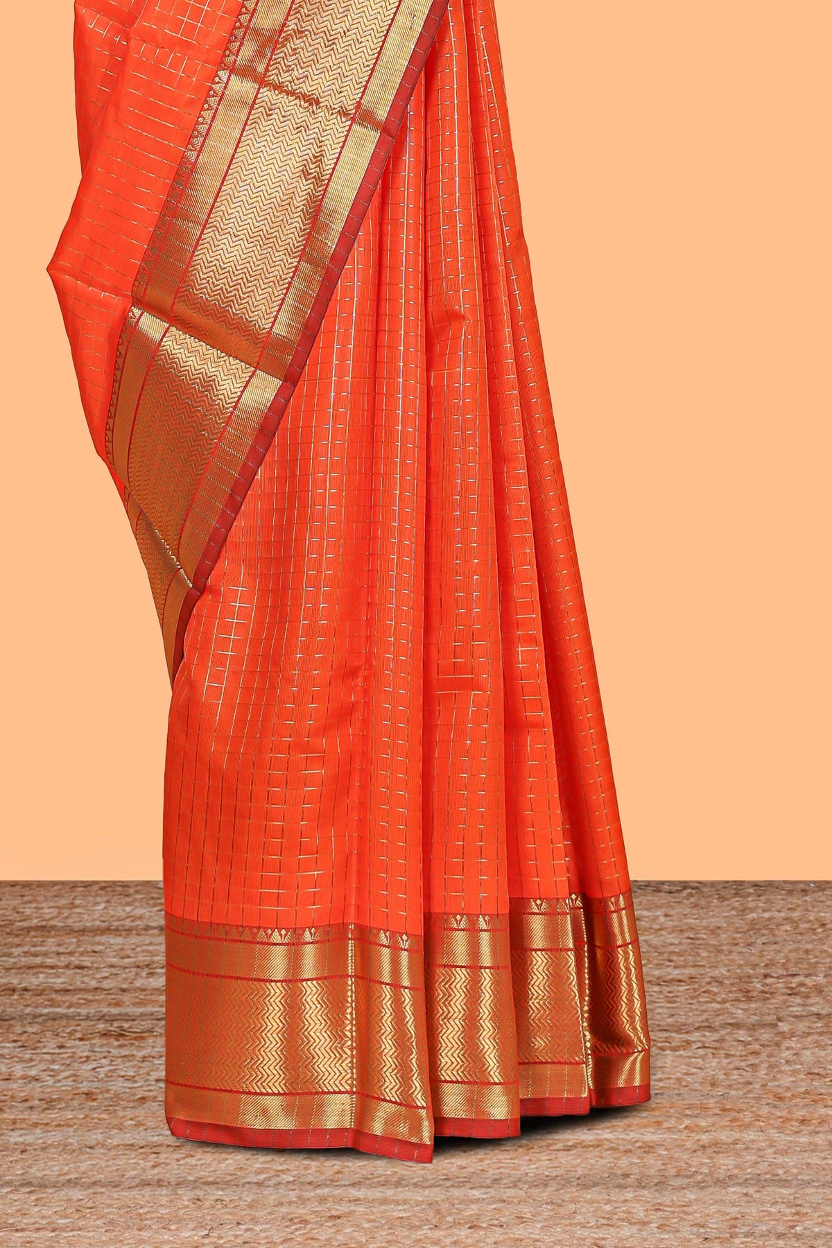 Orange colour semi soft silk all over checked pattern and  Contrast zari weaving border and contrast  blouse