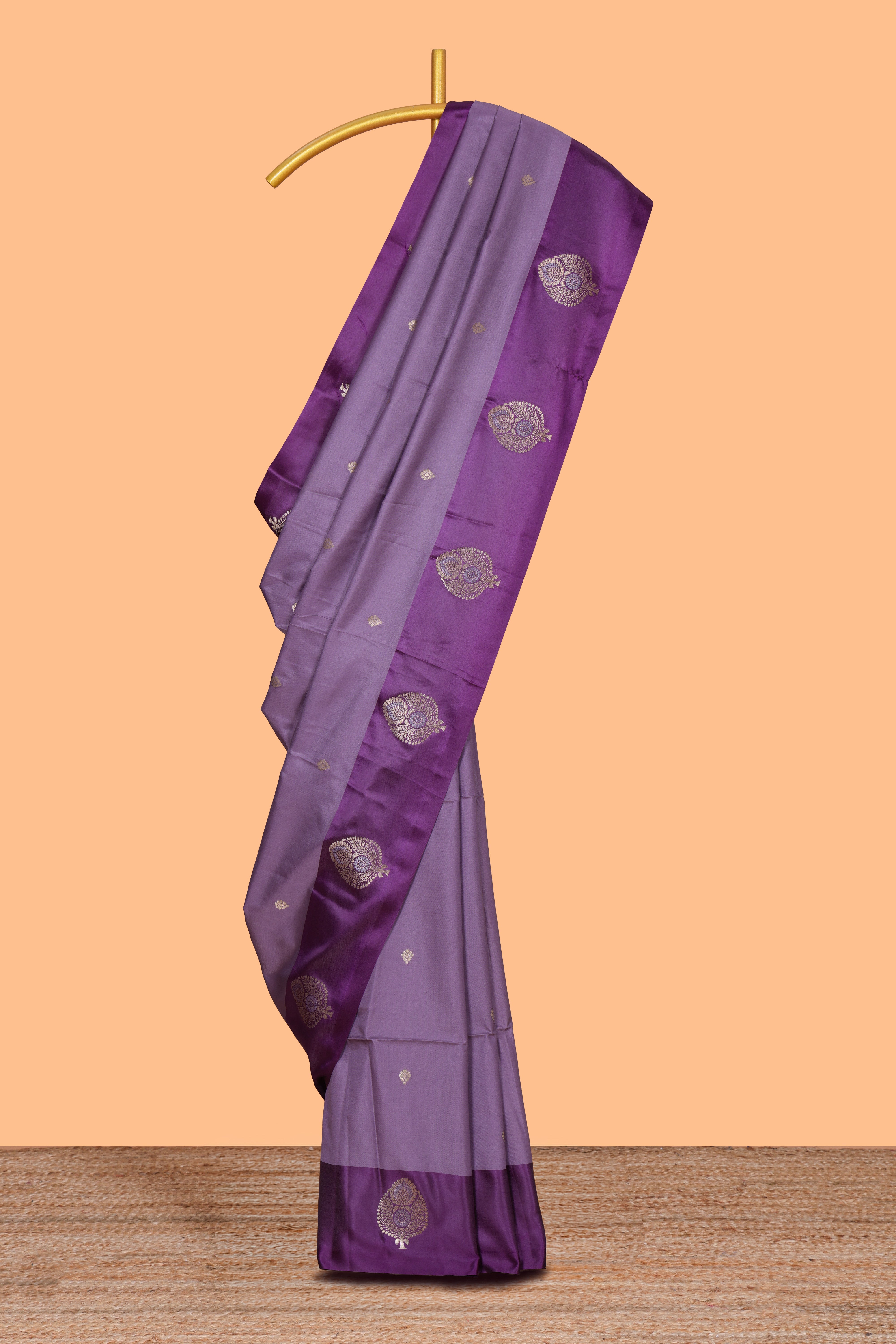 Lavender zari motifs design semi soft silk saree with contrast border and zari pallu