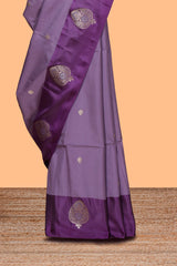 Lavender zari motifs design semi soft silk saree with contrast border and zari pallu
