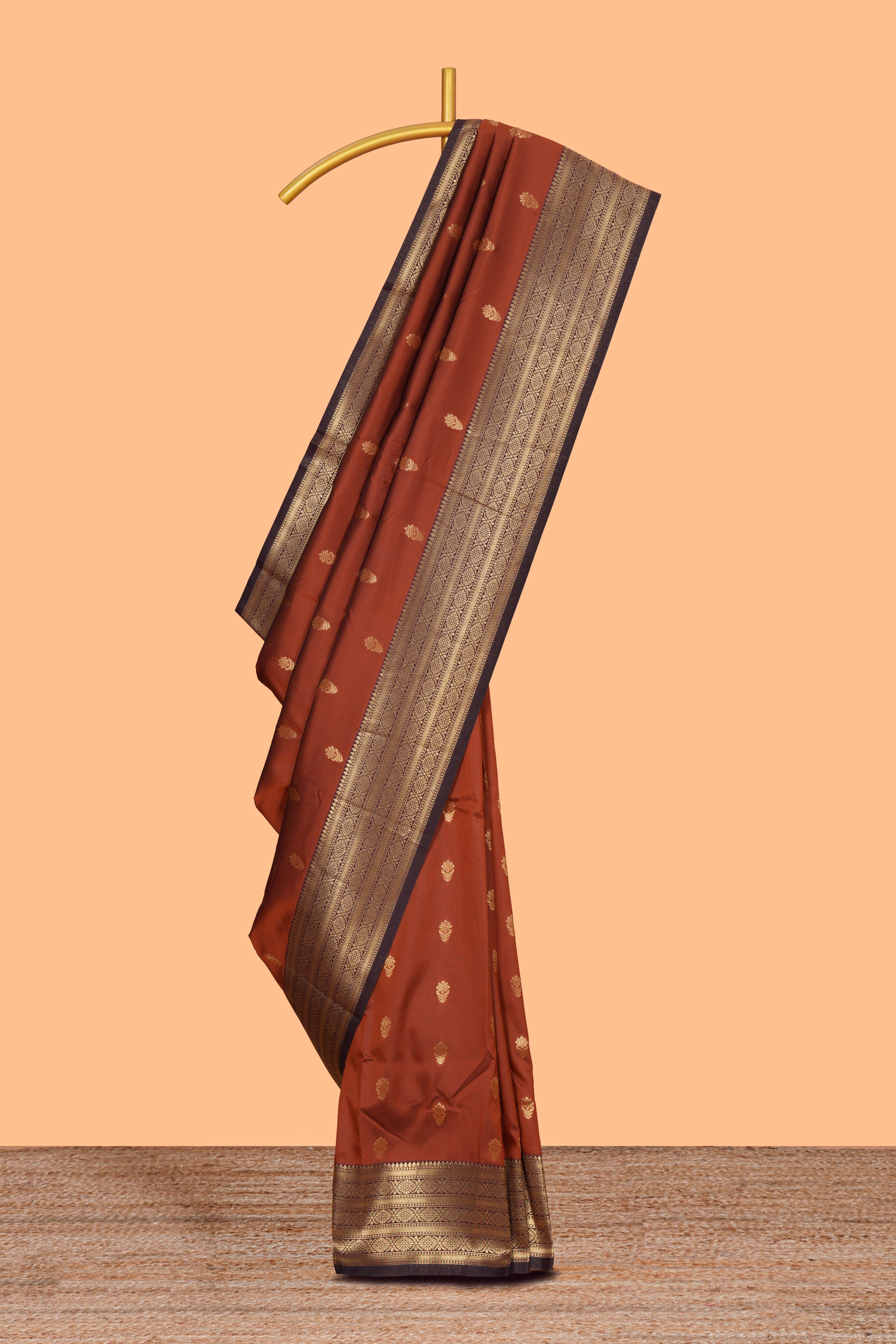 Rust orange zari motifs design semi soft silk saree with contrast border and zari blouse