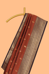 Rust orange zari motifs design semi soft silk saree with contrast border and zari blouse
