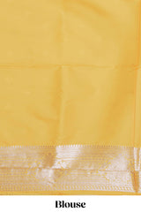 Yellow zari design semi soft silk saree with self zari border and matching blouse