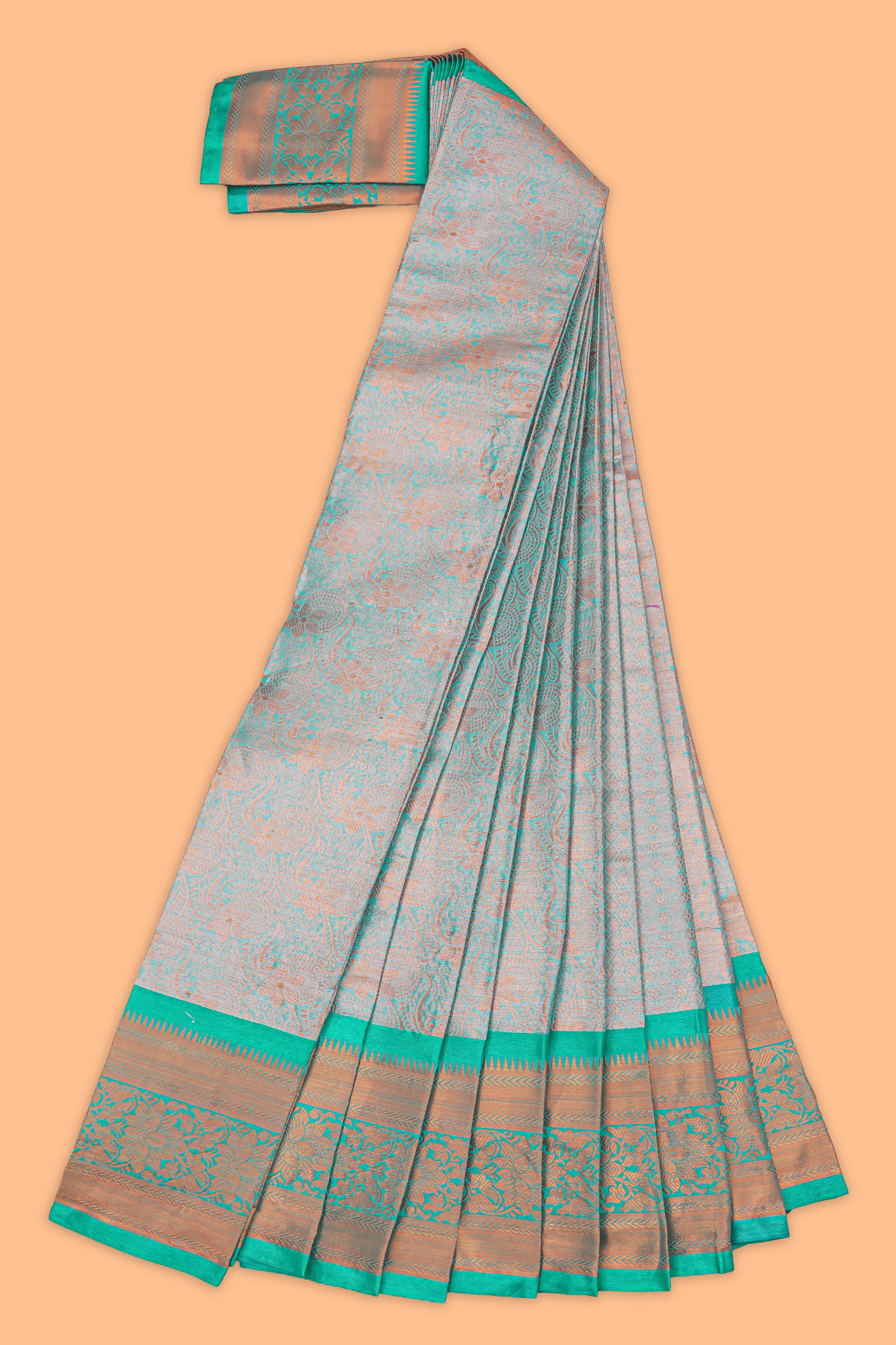 Turquoise green floral design semi soft silk saree with contrast border and blouse