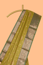 Green checked zari motifs design semi soft silk saree with contrast zari border and blouse