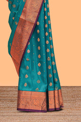 Green floral zari motifs design semi soft silk saree with contrast zari border and blouse
