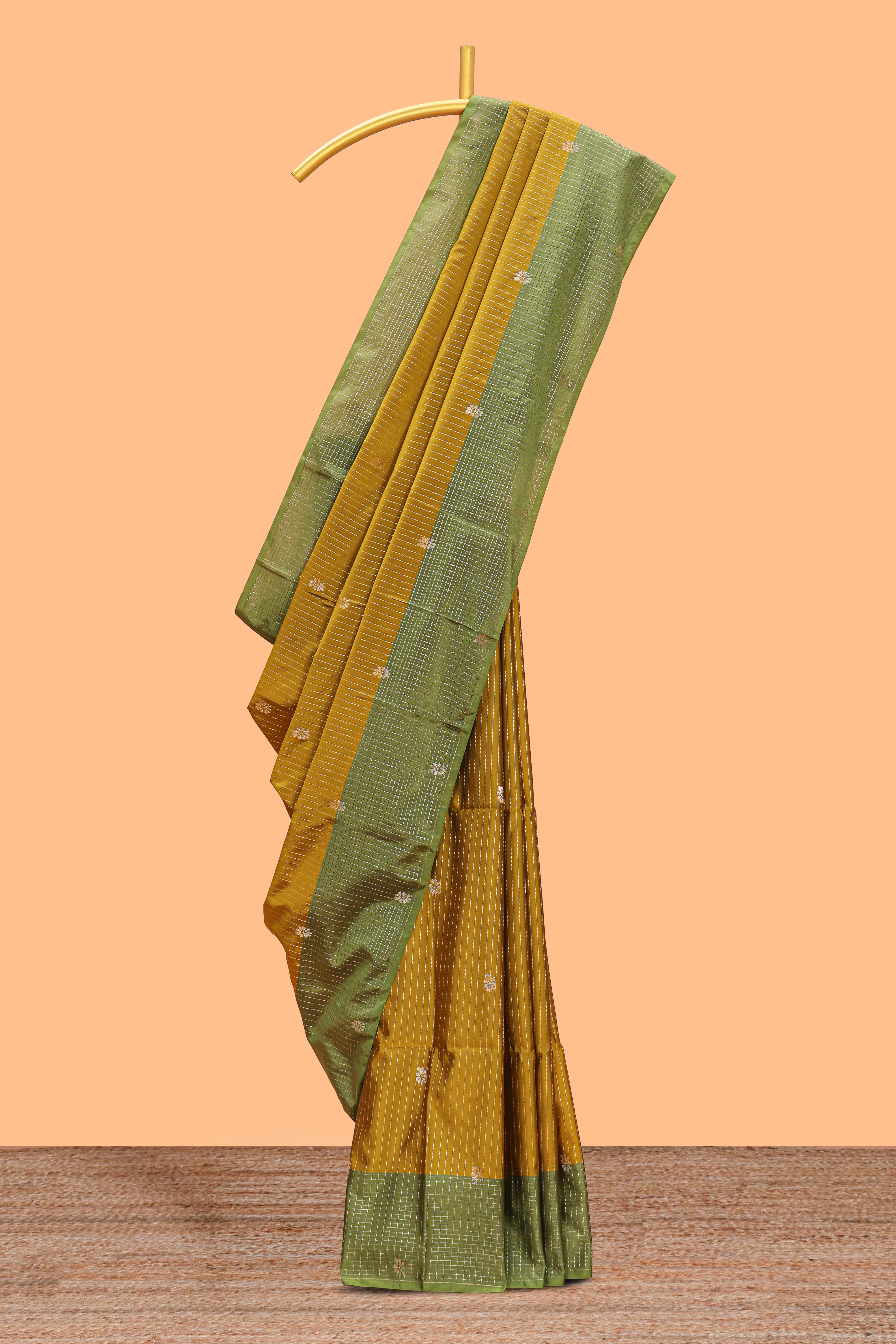 Mustard striped floral zari motifs design semi soft silk saree with contrast zari border and blouse