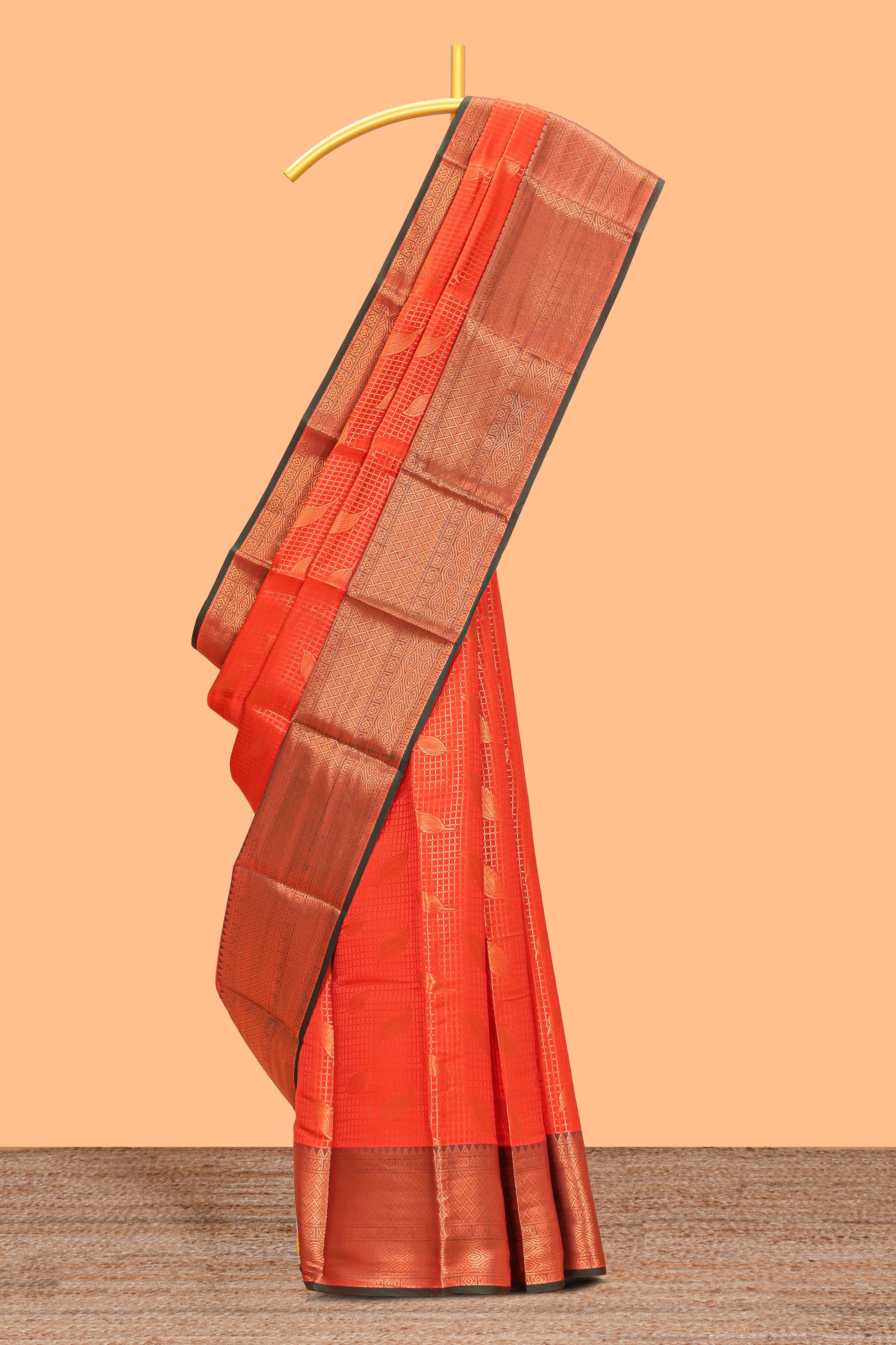 Orange checked leaf zari motifs design semi soft silk saree with contrast zari border and blouse